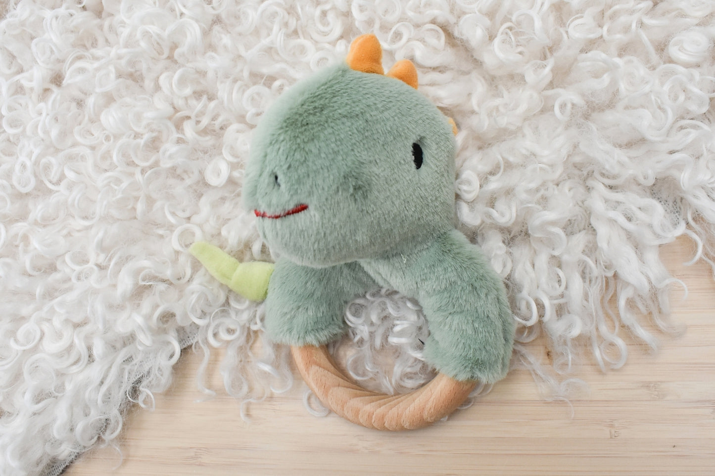 Snuggle buddy minty dinosaur wooden ring rattle