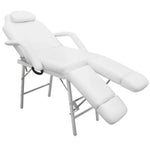 White treatment chair with ajustable legrests