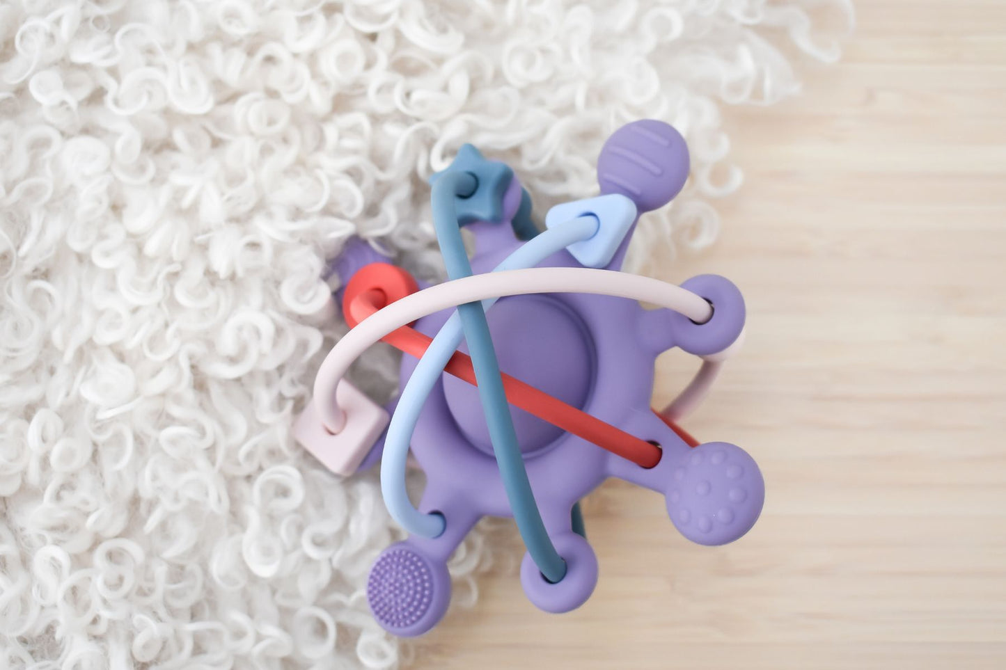 Silicone sensory space rattle teether purple