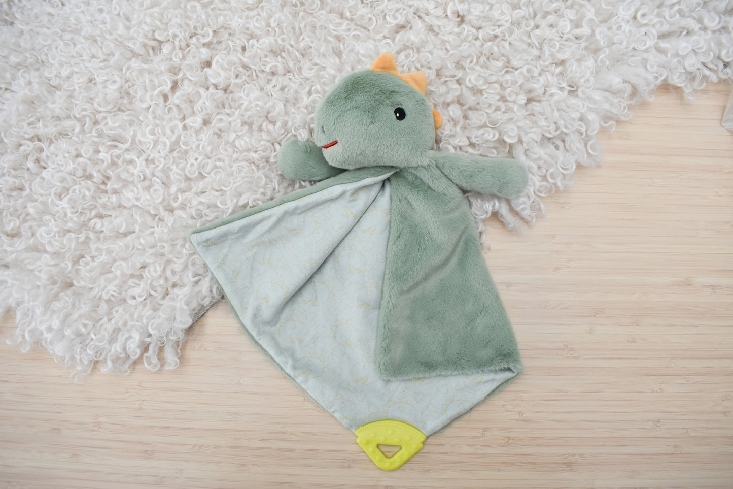 Snuggle buddy minty dinosaur blanket